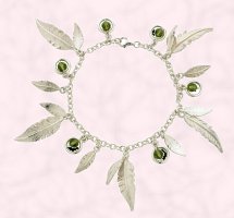  Curteis Jewellery 2007 contemporary style sterling silver ladies feather charm bracelet.from the 'feathers' collection within the 'inspired' jewellery range by Curteis Ltd. Semi precious beads comprise: Olivine Swarovski crystal. RRP: �70. 