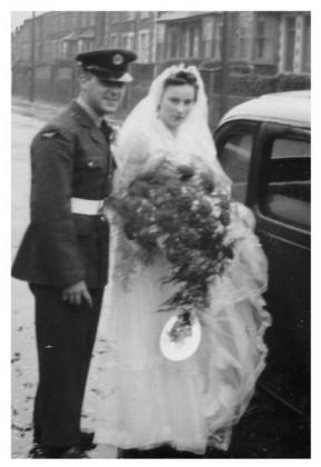 Dawn and Bryn Jenkins on their rainy 1954 wedding day.  