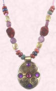 Amethyst and pink crystal necklace from bohofashionjewellery/co.uk.