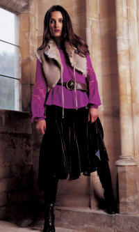 Wallis cross stitch blouse �45, plum velvet skirt �60,  beige sheepskin cropped shrug �40.