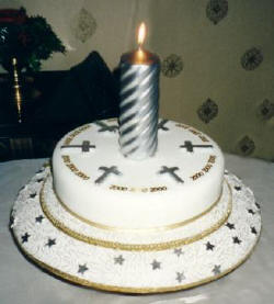 Picture of a millennium cake with sugarcraft crosses.