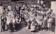 Carnival picture - sitting and eating at the carnival party in 1951. Costume history and fashion history 1950s.