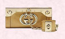 Gucci gold clutch bag and wristlet