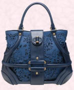 Blue suede and perforated leather butterfly bag is by Alexander McQueen. This bag is available from Browns Fashion of South Molton Street, London, UK or their online site at £1015