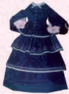 Picture of navy and pink Victorian style small costume. Fashion history and costume history dolls
