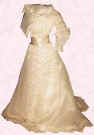 Picture of cream Edwardian S-bend style small costume. Fashion history and costume history dolls