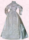 Picture of cream Victorian style small costume. Fashion history and costume history dolls