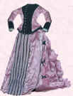 Picture of pink/black bustle mid Victorian style small costume. Fashion history and costume history dolls
