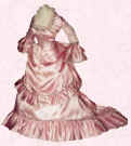 Picture of pink bustle mid Victorian style small costume. Fashion history and costume history dolls