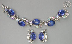 Fashion-era picture of Schiaparelli costume jewellery blue toned pieces from Glitterbug