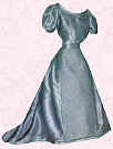 Picture of silver satin Edwardian small costume. Fashion history and costume history dolls