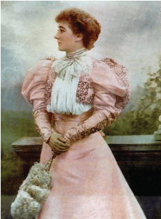 Picture of Mary Moore wearing an 1890's pink gown with leg of mutton sleeves. Fashion history and costume history.