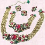 Right - Parure consisting of bracelet, necklace, ring and earrings.