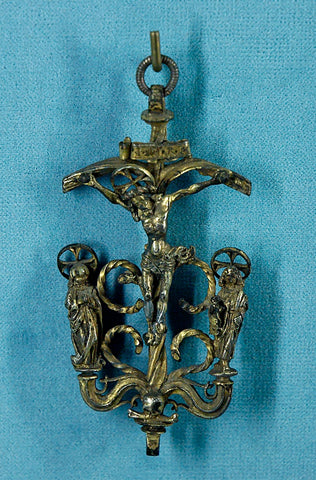 An antique German chased silver pendant depicting the crucifixion of Christ from the second half of the 15th century