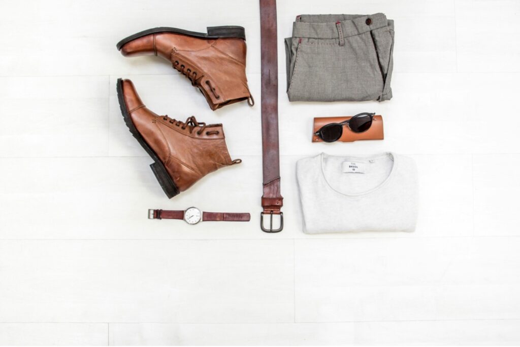 Neutral capsule wardrobe pieces arranged in a flat lay.
