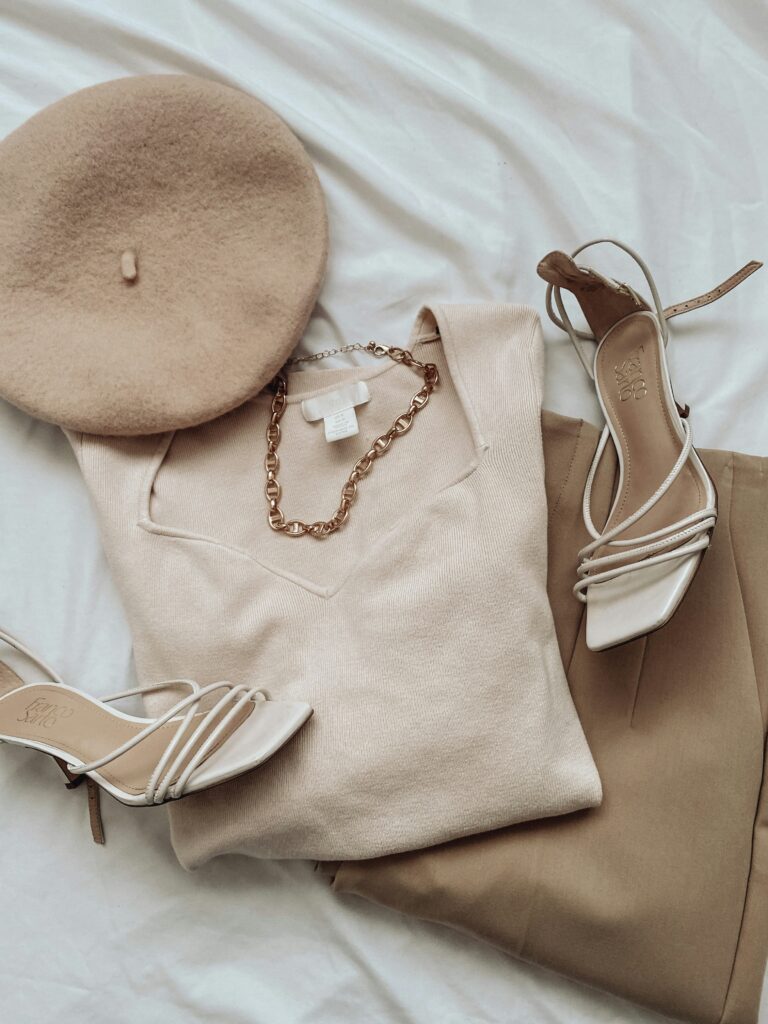 Beige minimalist outfit with knitwear, trousers, shoes, beret and gold necklace